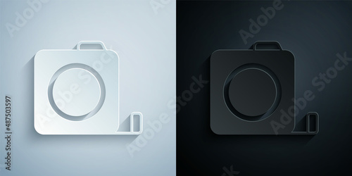Paper cut Roulette construction icon isolated on grey and black background. Tape measure symbol. Paper art style. Vector