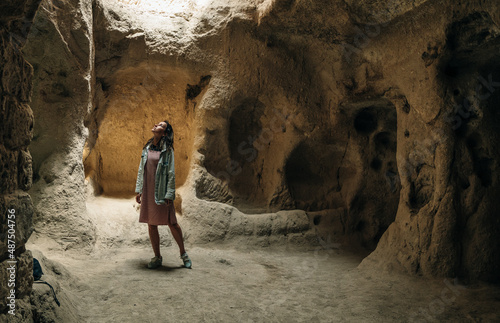 CAPPADOCIA, TURKEY - nov, 2021 tourist in The underground city of Mazikoy or Mazi, Cappadocia, Turkey photo