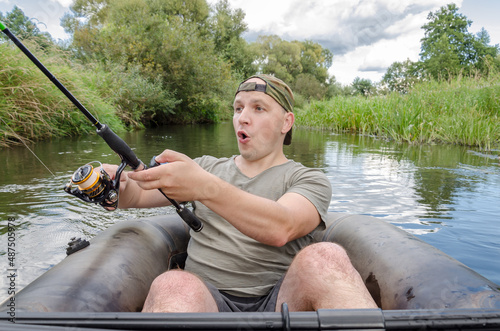 Portrait of a fisherman with a surprised face. photo