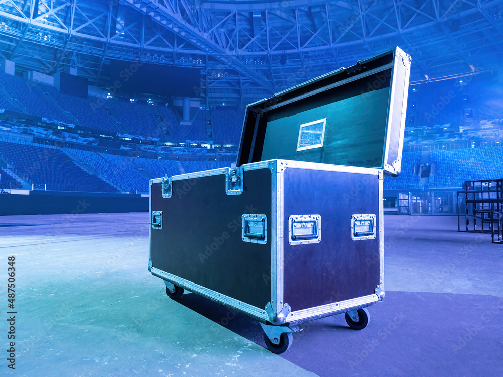 musical equipment drawer is open. Musical installation at stadium. Case on  wheels for sound equipment. Box for transportation and storage of sound  equipment. Music electronics rental concept Stock Photo