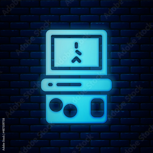 Glowing neon Portable tetris electronic game icon isolated on brick wall background. Vintage style pocket brick game. Interactive playing device. Vector
