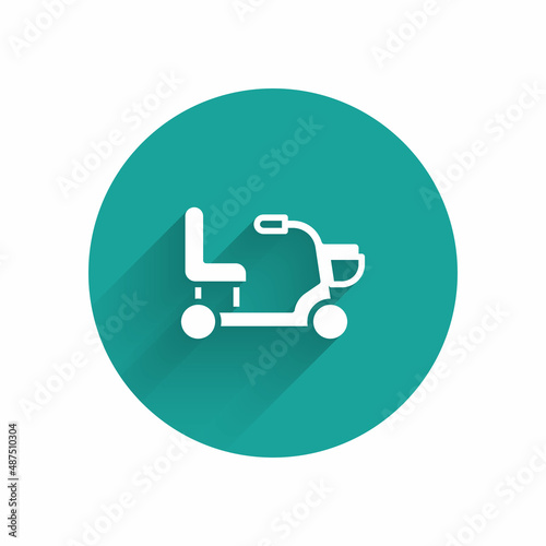 White Electric wheelchair for disabled people icon isolated with long shadow. Mobility scooter icon. Green circle button. Vector