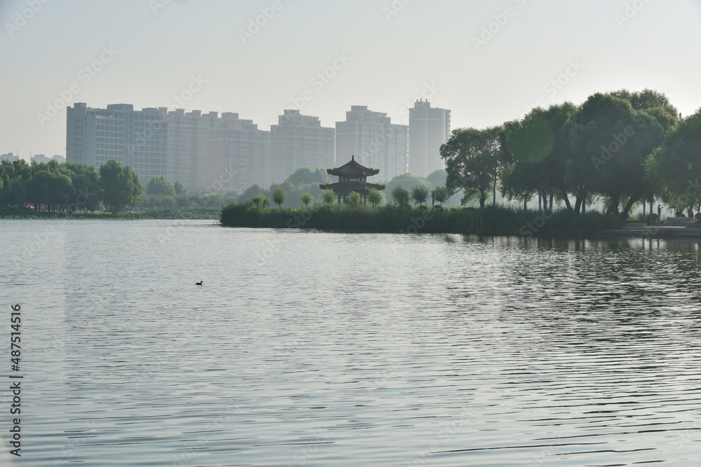 Hetang plank road and waterfront city skyline in urban park Hetang plank road and waterfront city skyline in urban park