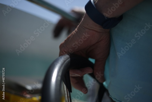 boat captain holding a rail in the florida keys