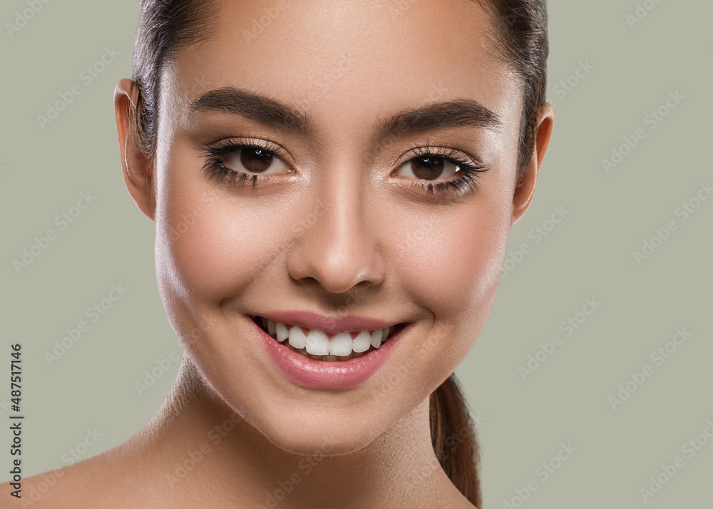 Beautiful freckles woman brunette hair concept portrait healthy skin. Color background green Beautiful freckles woman brunette hair concept portrait healthy skin. Color background green