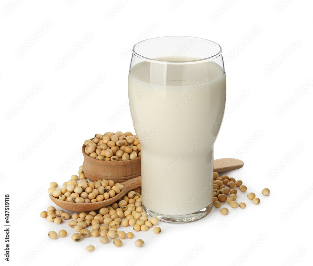 Glass of fresh soy milk and beans on white background Glass of fresh soy milk and beans on white background