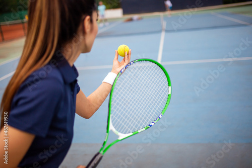 Portrait of happy fit young woman playing tennis. People sport healthy lifestyle concept © NDABCREATIVITY