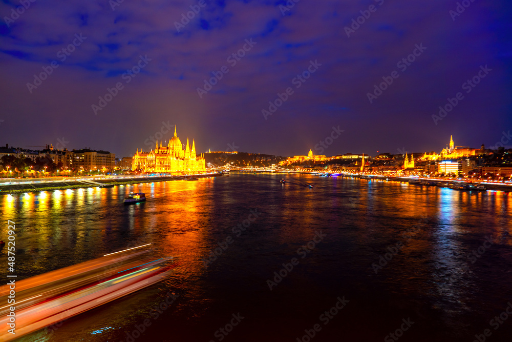 Wonderful mesmerizing view of the city at night illuminated by lights on the danube river. Hungary, budapest. Wonderful architecture at night. Beautiful landscape on the parliament on the river.