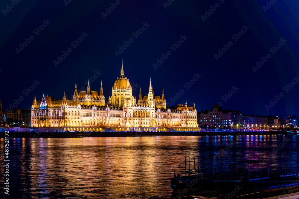 Beautiful architecture illuminated by lanterns. A magical view of the ancient city. Hungarian parliament building at night, budapest, hungary. A beautiful old building on the danube river