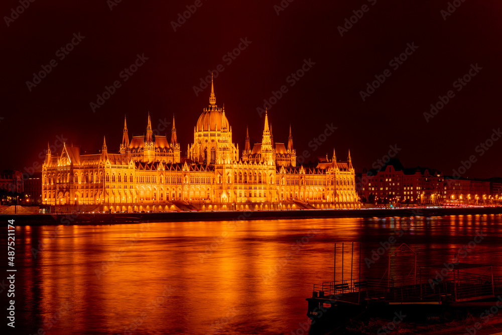 Beautiful architecture illuminated by lanterns. A beautiful old building on the danube river. Hungarian parliament building at night, budapest, hungary. A magical view of the ancient city