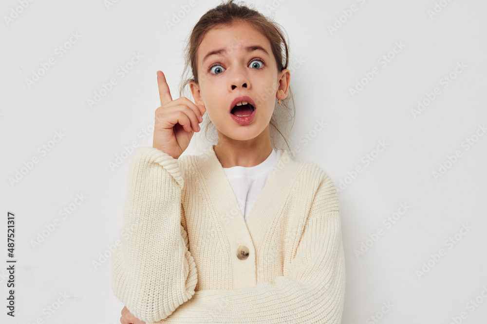 cute girl posing in a white sweater isolated background cute girl posing in a white sweater isolated background
