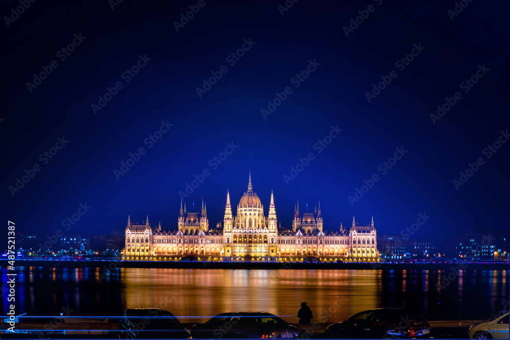 A magical view of the ancient city. A beautiful old building on the danube river. Hungarian parliament building at night, budapest, hungary. Beautiful architecture illuminated by lanterns