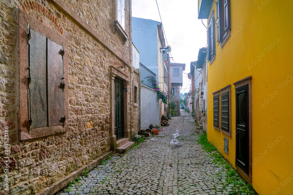 Ancient narrow street in europe. A path made of stone. Ancient houses. Antique architecture.