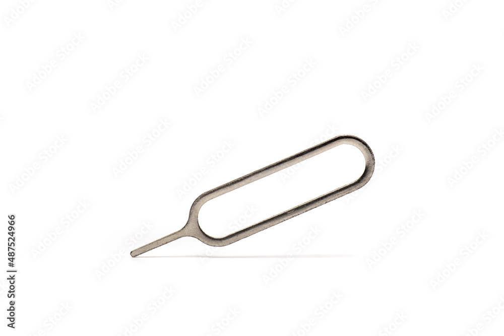 Closeup metal cell phone needle white background Closeup metal cell phone needle white background