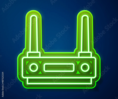 Glowing neon line Router and wi-fi signal icon isolated on blue background. Wireless ethernet modem router. Computer technology internet. Vector