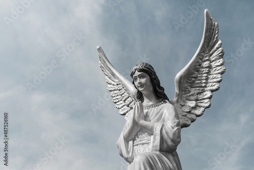Angel girl in prayer. (concept of faith and hope)