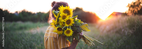 Fototapeta Girl and sunflowers