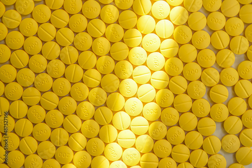 yellow tablet of medicine background