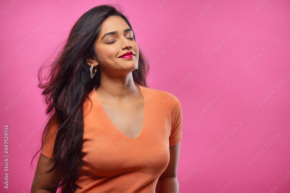 Portrait of a beautiful woman posing with closed eyes and blowing hair Portrait of a beautiful woman posing with closed eyes and blowing hair