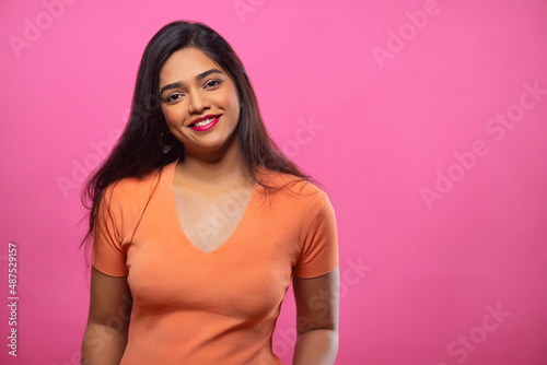 Adult woman posing in front of camera with smile