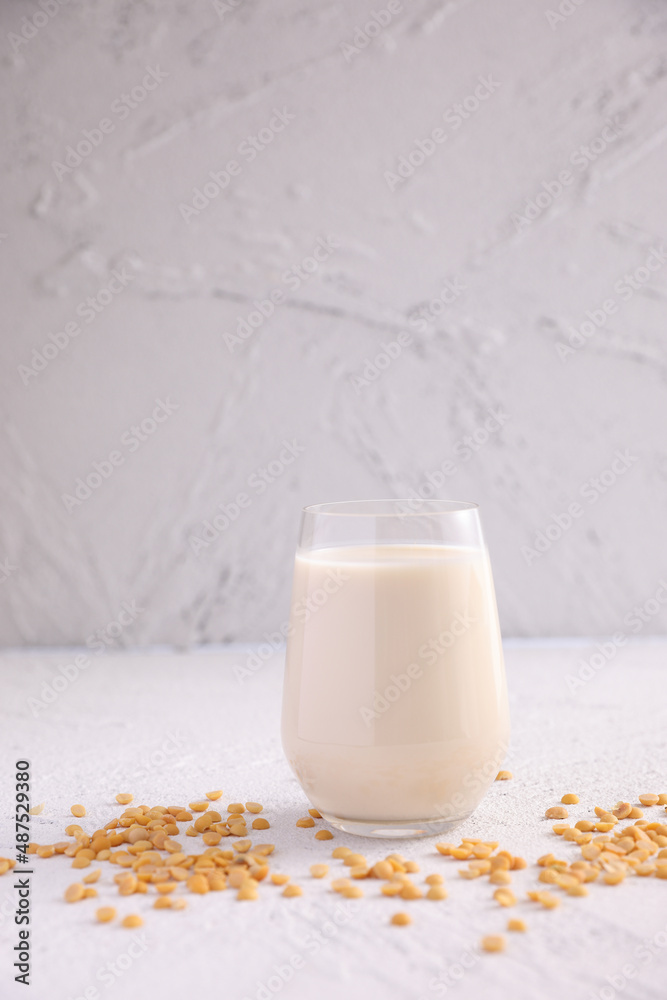 Soy milk in glass and soy bean isolated in white background Soy milk in glass and soy bean isolated in white background