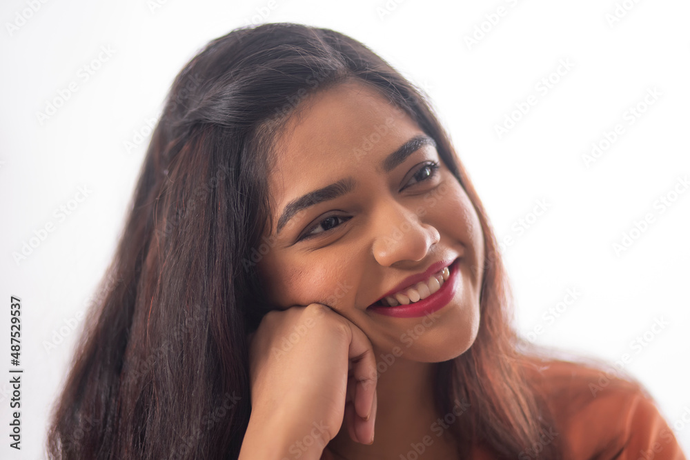 Close-up portrait of smiling woman with hand on cheek Close-up portrait of smiling woman with hand on cheek