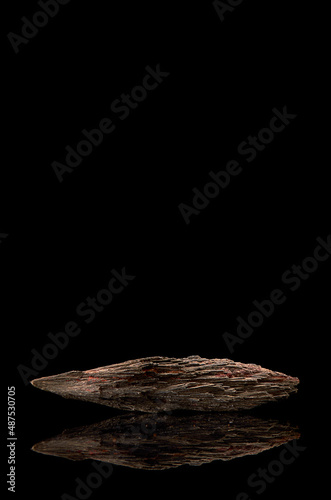 Stibnite (antimonite or stibinite) is a group II mineral (sulfides), according to the Strunz classification. It is the main ore of antimony. Black background. Vertical. reflection photo