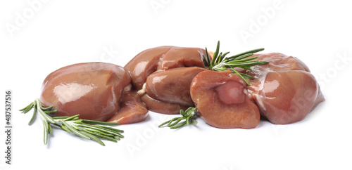 Fresh raw beef kidneys with rosemary on white background