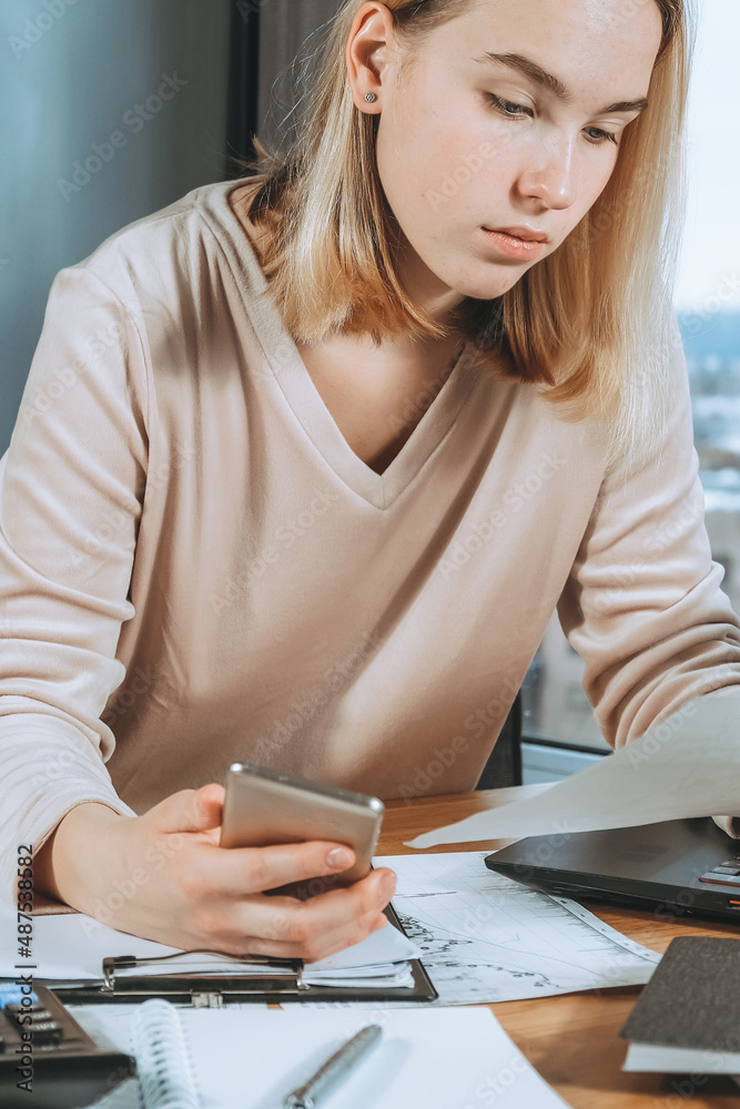Investments. Young woman investor buys stocks on the stock exchange stock market from home. Generation z invests budget analyzes income of digital money. Cryptocurrency trading. Investor freelancing Investments. Young woman investor buys stocks on the stock exchange stock market from home. Generation z invests budget analyzes income of digital money. Cryptocurrency trading. Investor freelancing