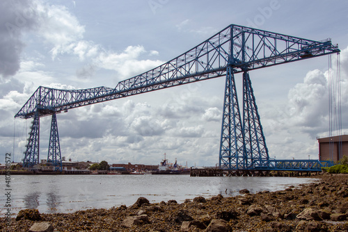 Blue steel Middlesborough Transporter Bridge from shore with clouds UK photo