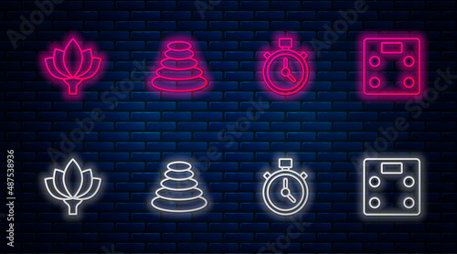 Set line Stack hot stones, Stopwatch, Lotus flower and Bathroom scales. Glowing neon icon on brick wall. Vector