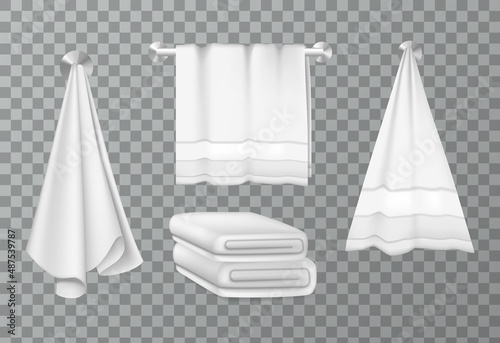 Cloth fluffy towels on hangers and folded in stack for bathroom