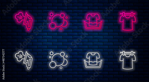 Set line Soap water bubbles, Basin with shirt, Electric iron and Drying clothes. Glowing neon icon on brick wall. Vector