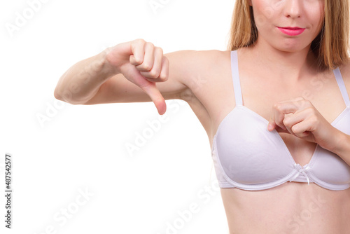Woman dissatisfied with size of bra breasts