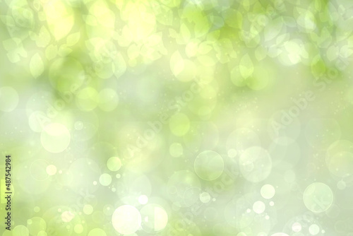 Hello spring background. Abstract bright spring or summer landscape texture with natural green yellow bokeh lights and sunshine. Beautiful backdrop with space.