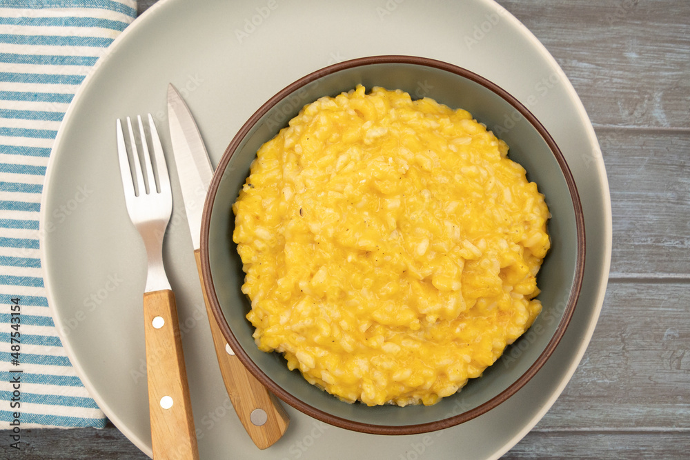 butternut risotto in a bowl on a table butternut risotto in a bowl on a table