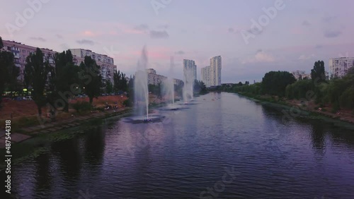 Rusanivsky Fountains at purple dusk, Kyiv, Ukraine photo