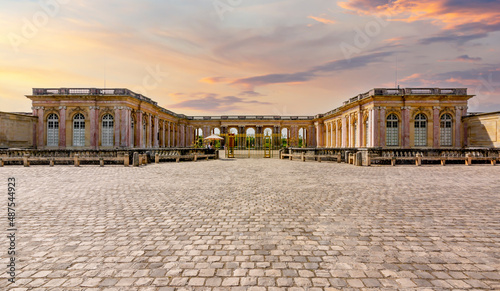 Grand Trianon palace in Versailles park outside Paris at sunset, France