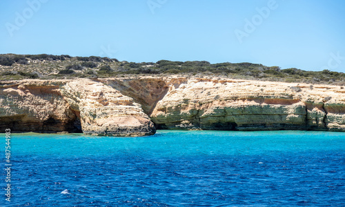 Koufonisi island, Cyclades, Greece. Xilombatis Cave, rocky formation, calm Aegean sea