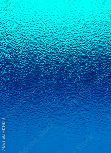 Texture of Water Droplets on Chilled Drink Glass in Gradient Blue Color