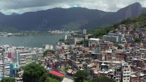 Aerial view cityscape of Rio de Janeiro. Favelas on a mountain slope in the city center with skyscrapers and a background of the ocean and mountains. photo