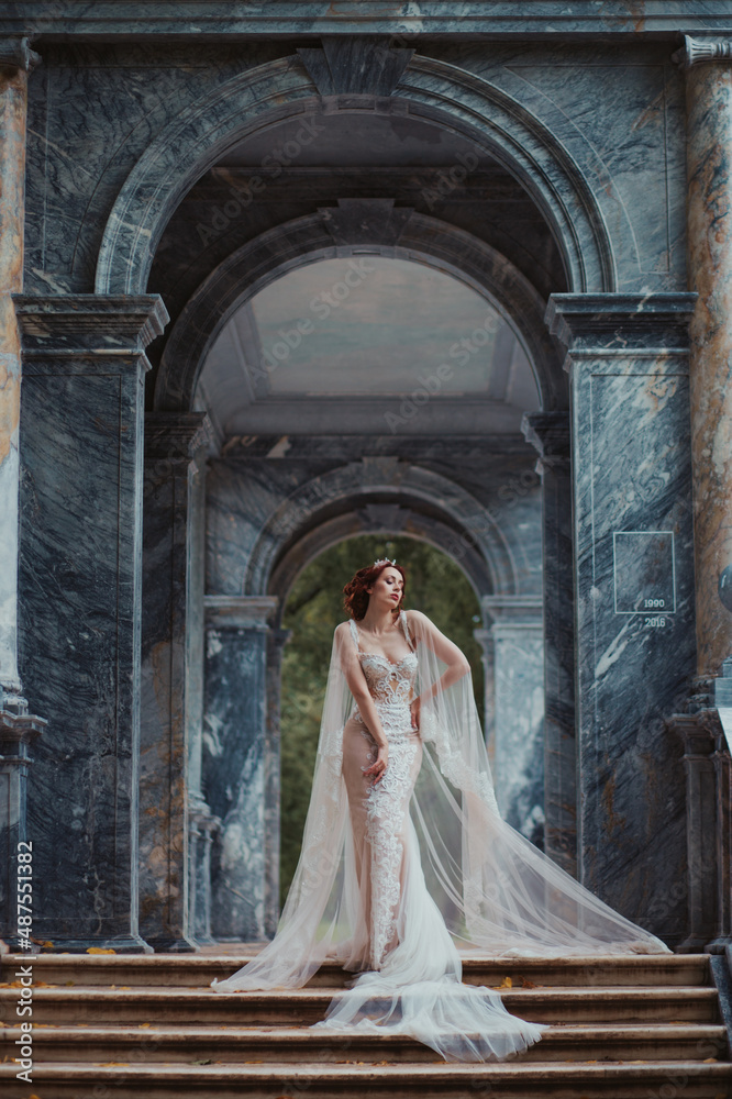 young woman bride posing in beautiful dress