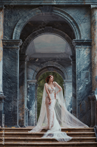 young woman bride posing in beautiful dress