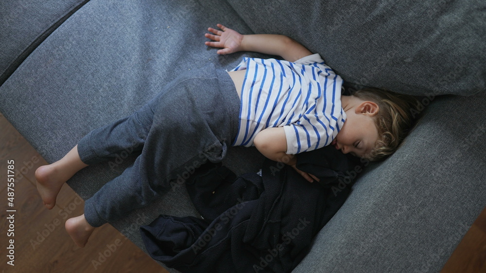 Child napping on couch in the afternoon Child napping on couch in the afternoon