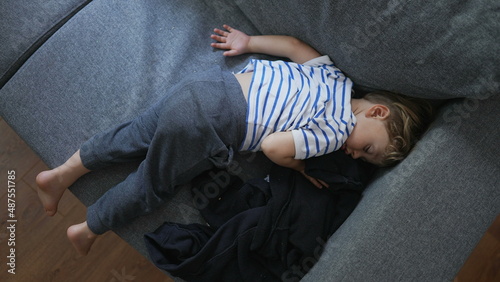 Child napping on couch in the afternoon