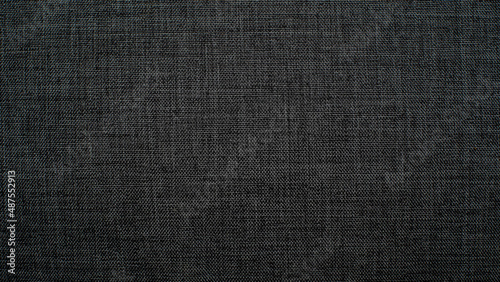 Chair fabric texture dark grey as background 