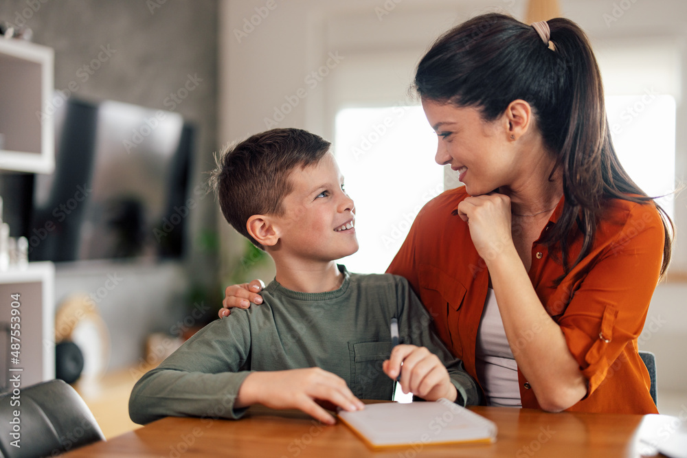 Mother's day, caucasian mother and son, glancing at each other, laughing. Mother's day, caucasian mother and son, glancing at each other, laughing.