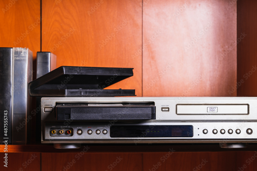 Obraz premium retro vhs tape player, wearing a jacket in the style of the 90s,