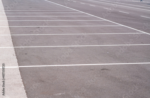 Empty city parking lot with clear markings. Marking on an asphalt road. Free parking spaces or place for car.