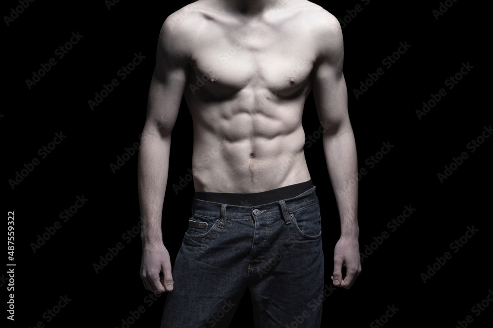 Sexy man body with six pack abs isolated on black